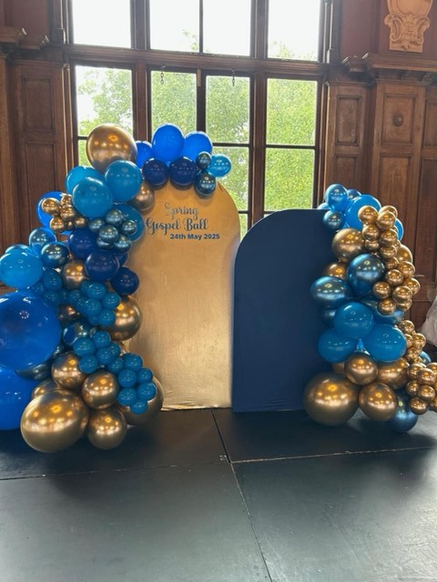 Blue and gold balloon backdrop