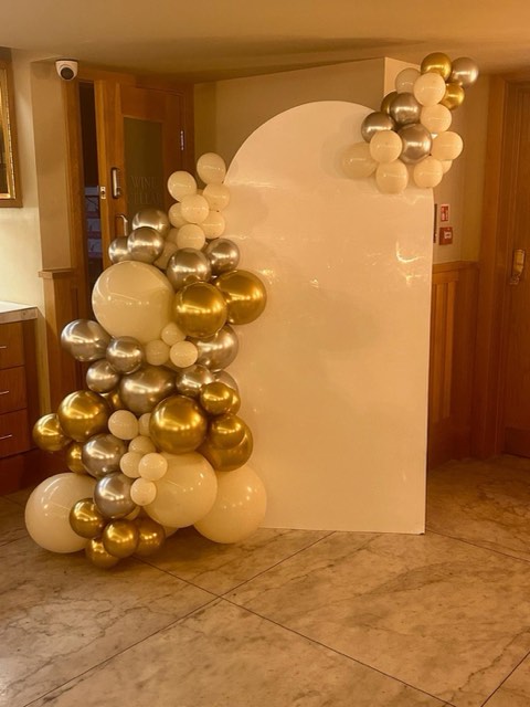 Gold and white balloon arch