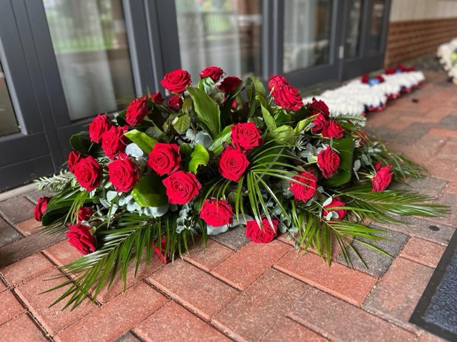 Red casket spray