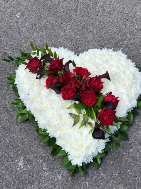 White heart tribute with red roses