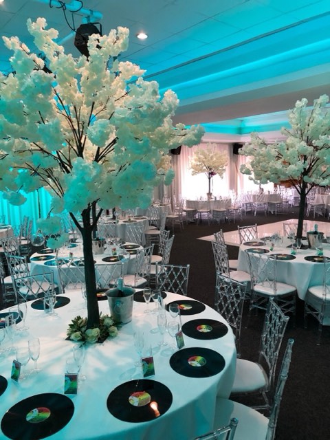 Blossom tree centrepieces in a ballroom